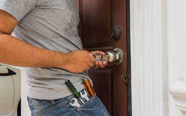 residential locksmith fixing a doorknob in Las Vegas