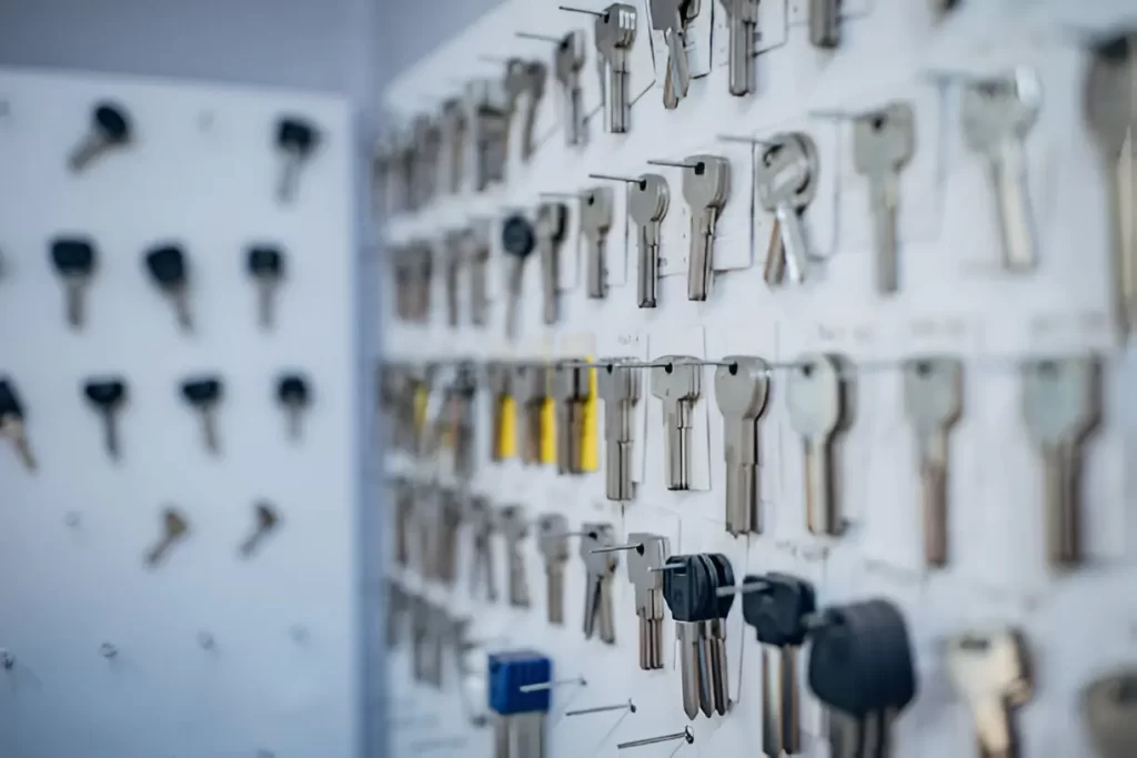 Locksmith cutting a replacement key on-site using mobile key duplication tools